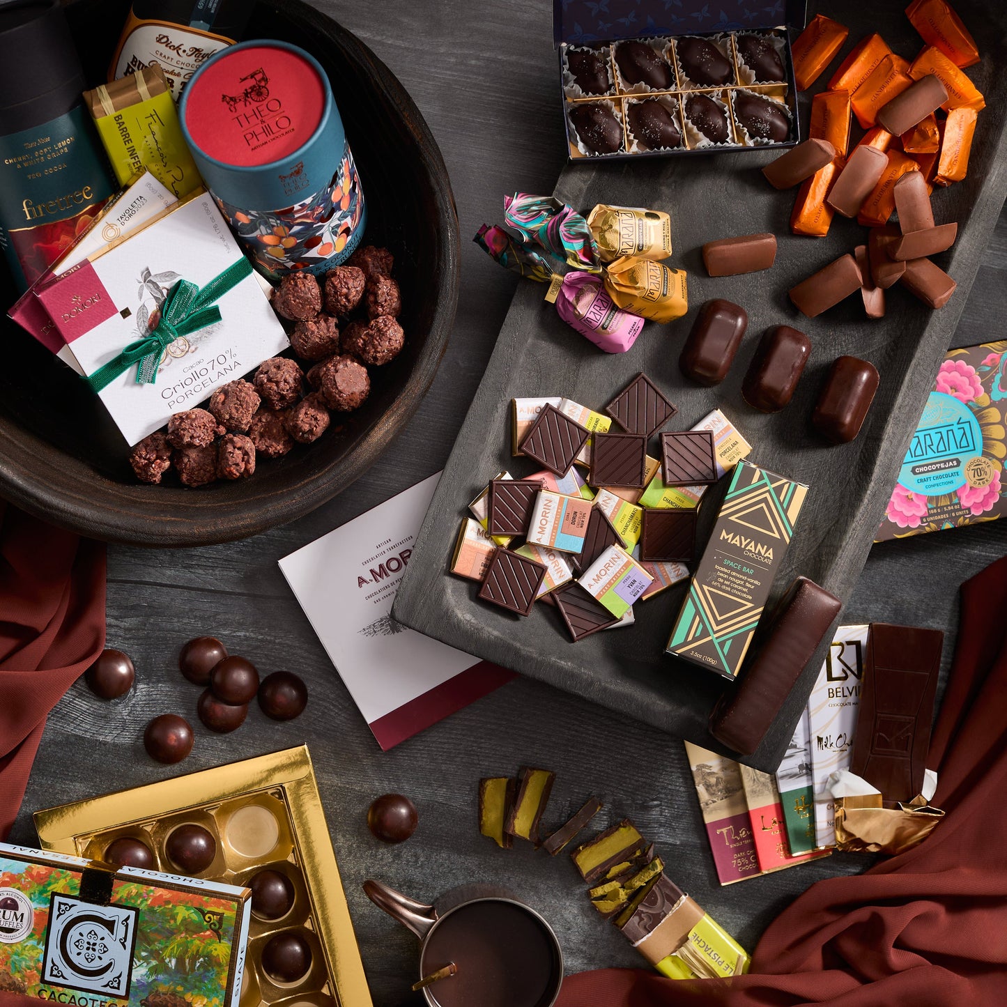 Grand Chocolate Voyage Luxury Gift: vibrant chocolates in colorful wrappers and blue floral tin