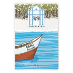 Stylized white and brown Chuao 70% cacao boat on blue water