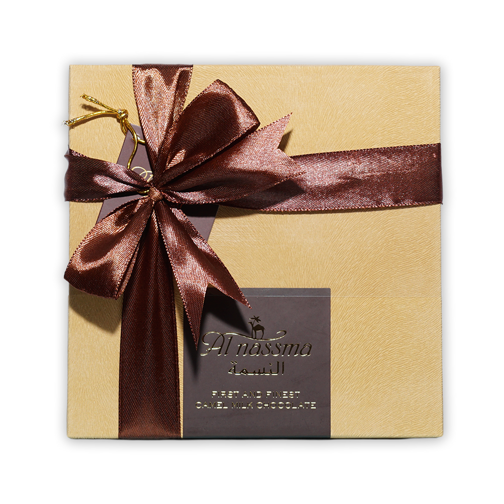 Al Nassma camel milk praline chocolate gift box 9 pcs gold with burgundy bow