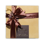Al Nassma camel milk praline chocolate gift box 9 pcs gold with burgundy bow