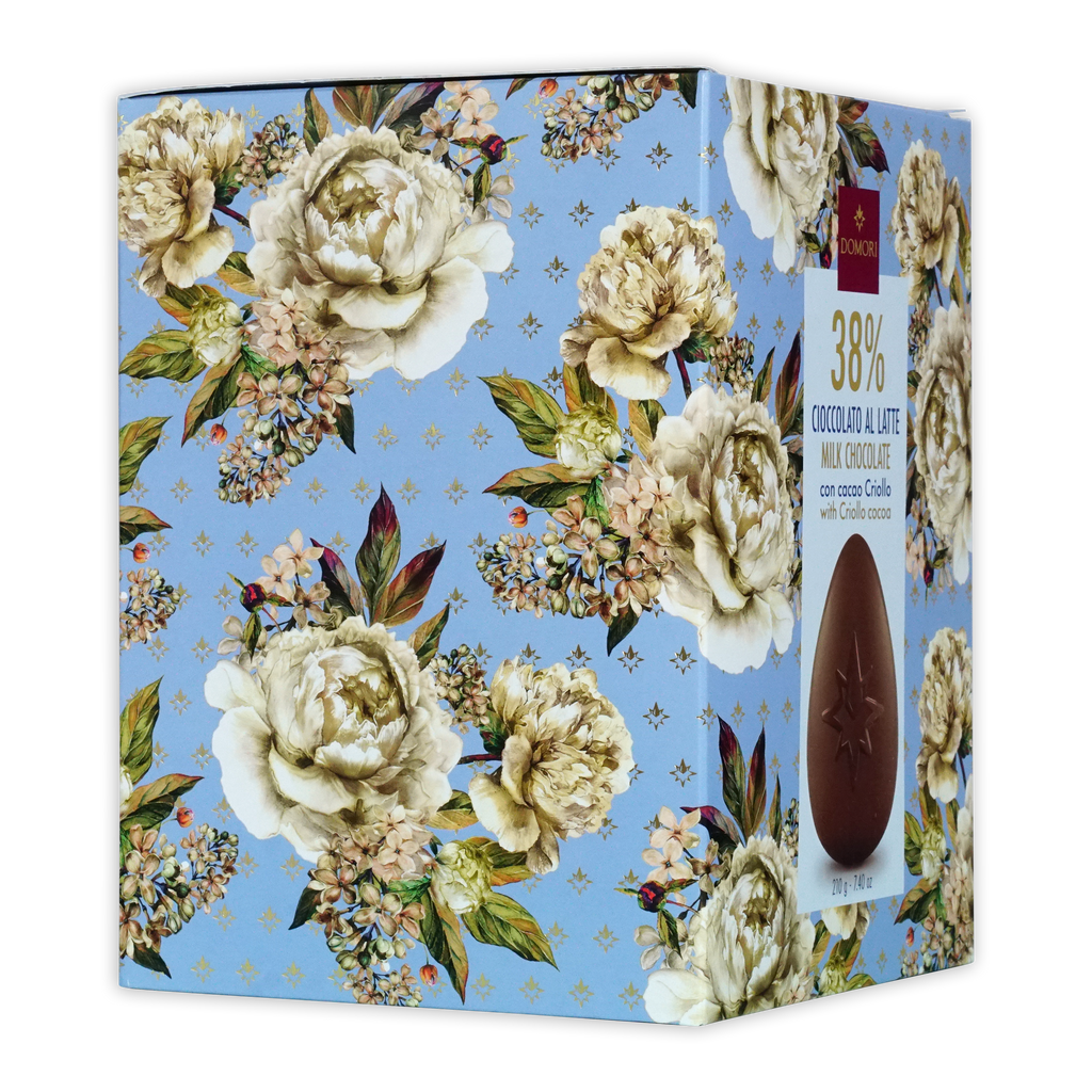 Rectangular domori easter egg milk chocolate box with 38% cocoa on a light blue floral cream and green background