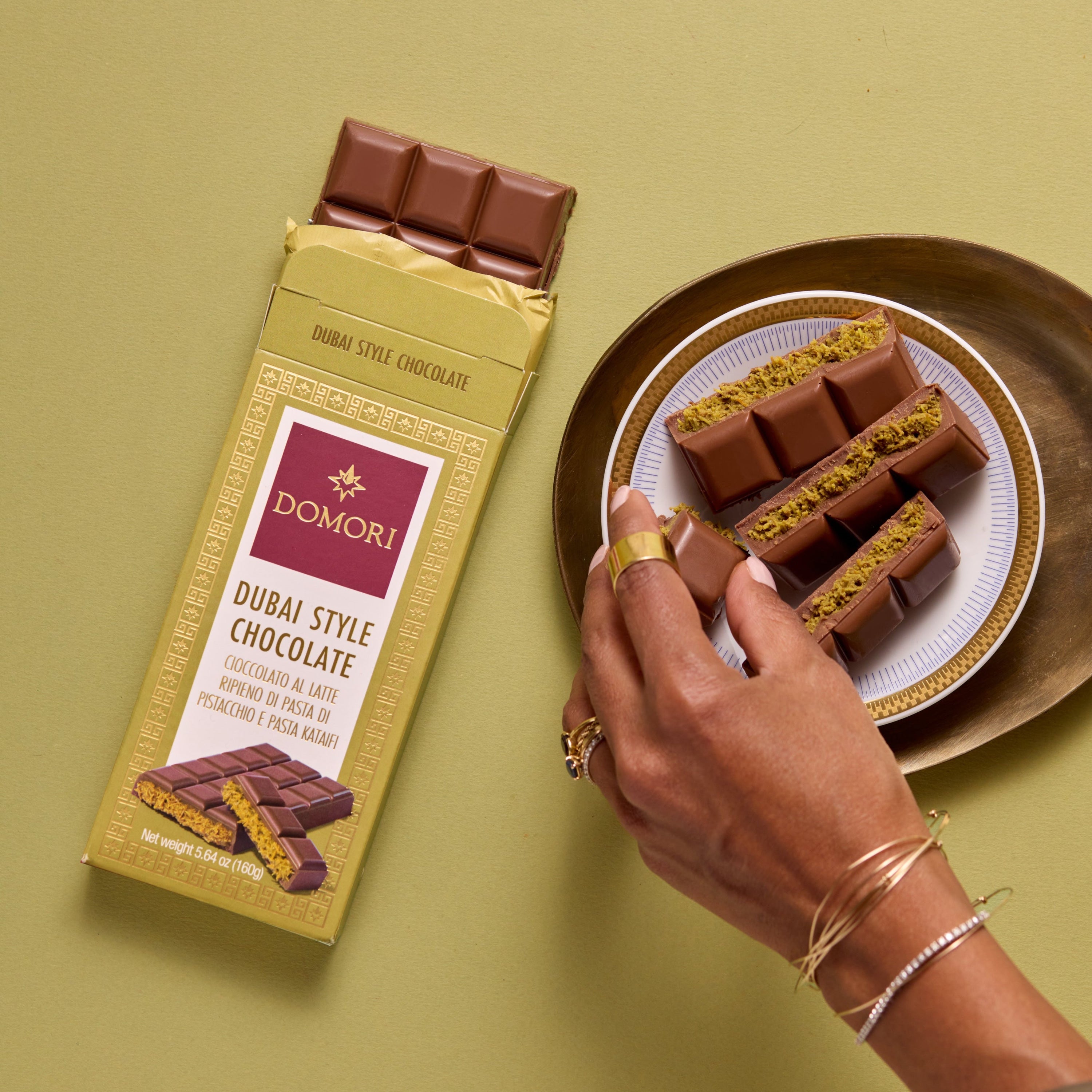Domori Dubai milk chocolate bar with golden wrap and pistachio filling