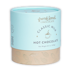 French Broad Milk Hot Chocolate Mix in light blue cylindrical can with beige base and gold leaf patterns