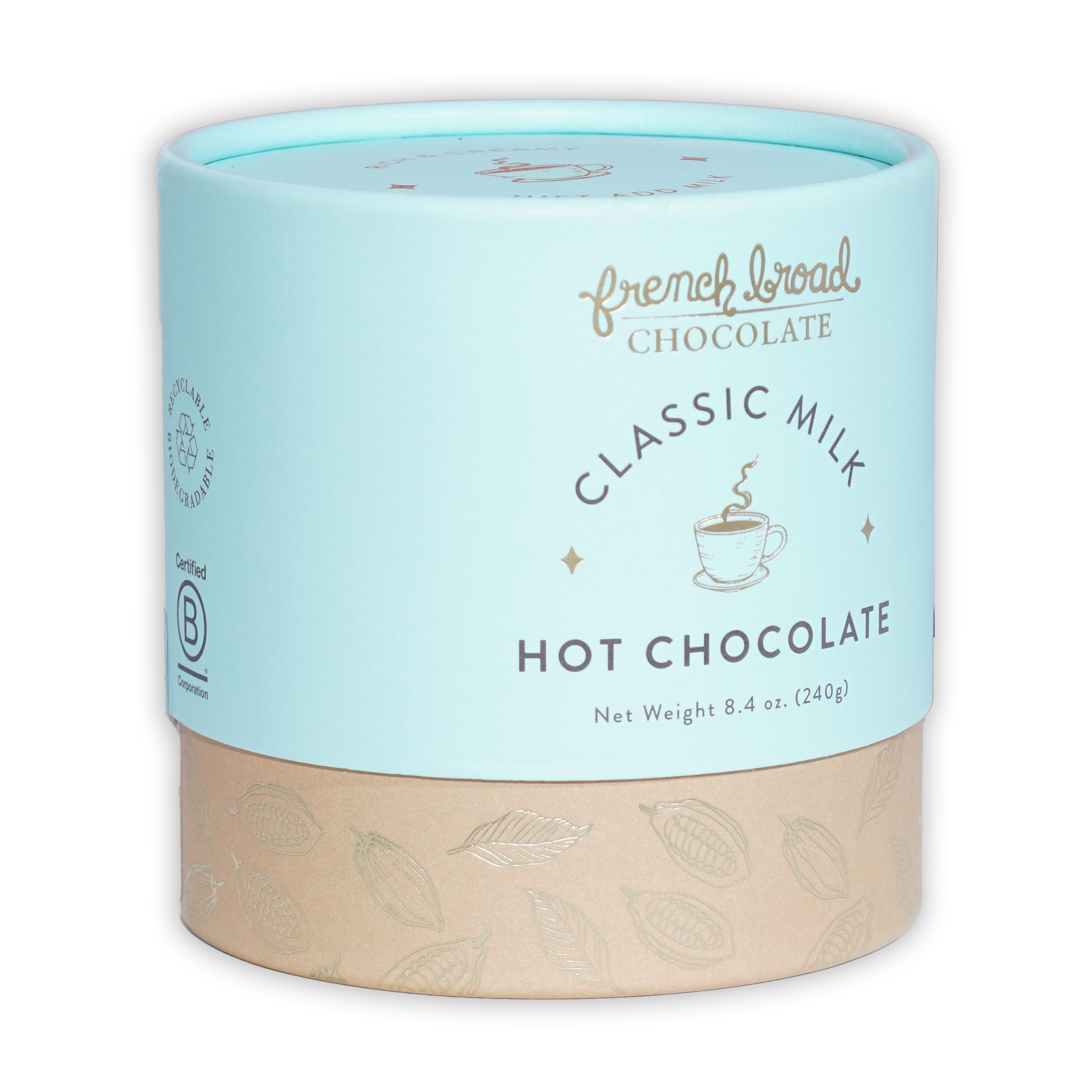 French Broad Milk Hot Chocolate Mix in light blue cylindrical can with beige base and gold leaf patterns