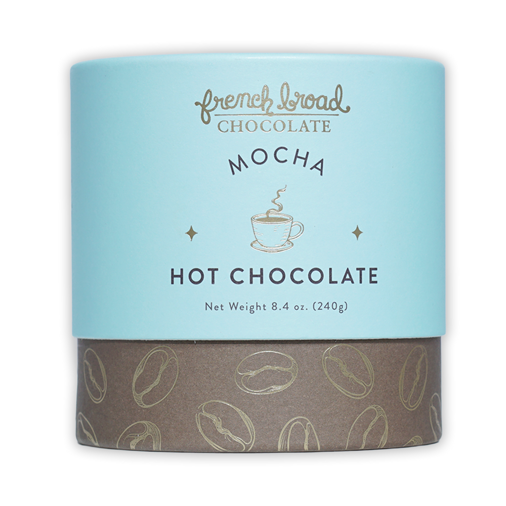 French Broad Mocha Hot Chocolate in blue-brown canister with coffee beans