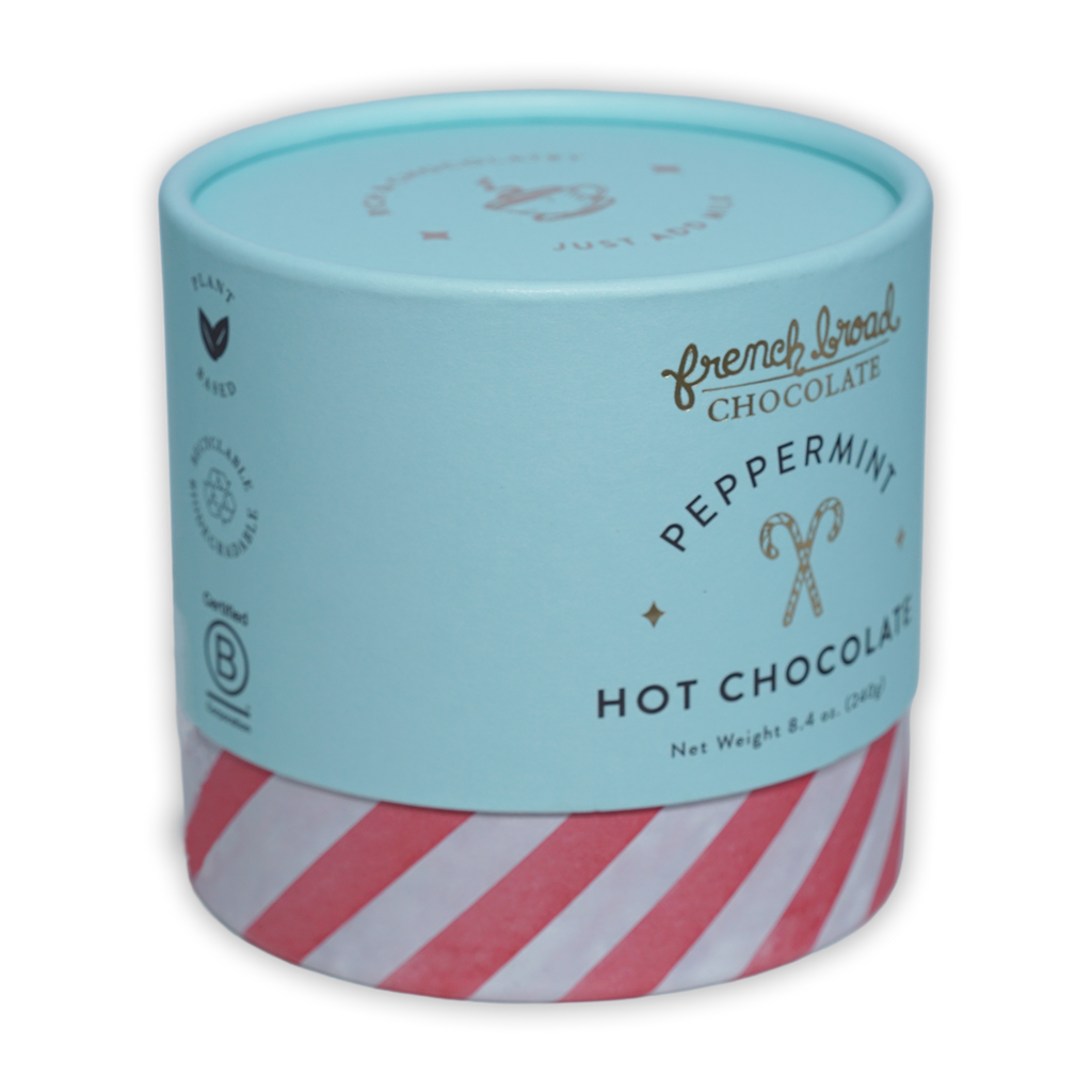 French Broad peppermint hot chocolate in mint green red-striped cylinder