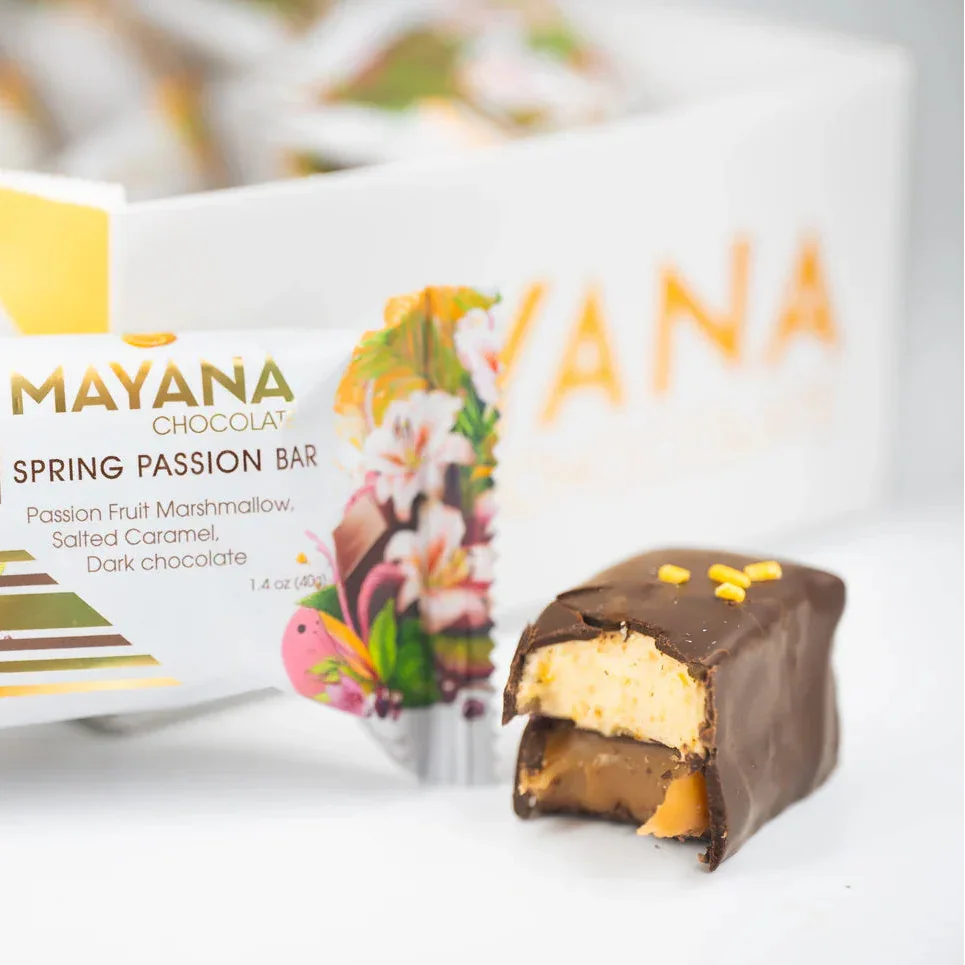 Partially eaten Mayana Chocolate Mini Spring Passion Bar revealing marshmallow and caramel