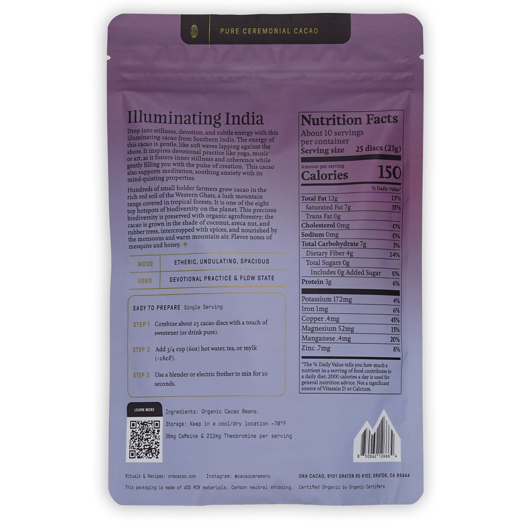 The back of a purple resealable pouch of Pure Ceremonial Cacao 'Illuminating India' The packaging features product details, nutritional facts, preparation instructions, and a QR code.