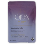 A purple and lavender stand-up pouch of Ora cacao 'Illuminating India' organic  cermonial cacao
