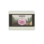 Ranger rosé bonbons box with six pink and brown candies in a white rectangular box featuring forest imagery