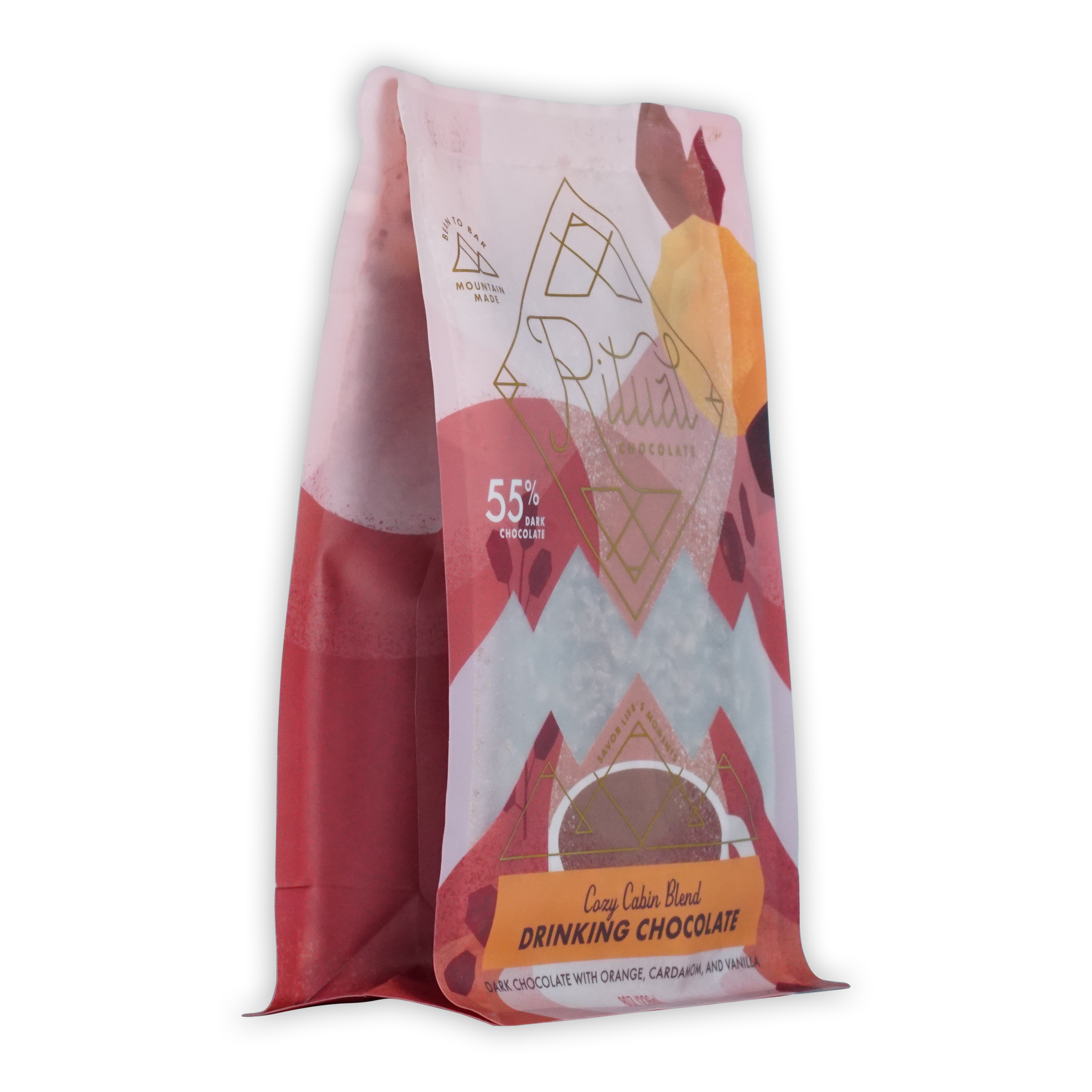 A vibrant pink and white bag of ariana’s cozy cabin blend ritual drinking chocolate 55 percent with geometric orange accents