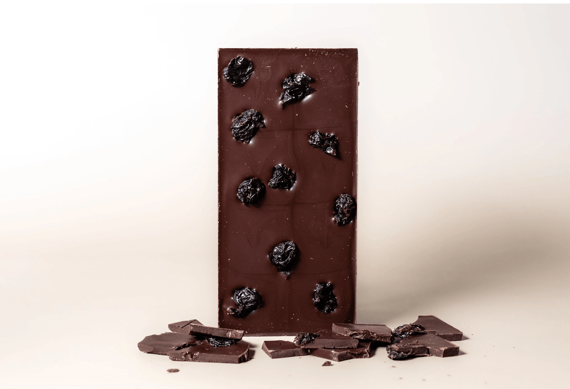 Ritual Dark Cherry Vanilla Bar 70% with raisins on smooth brown surface