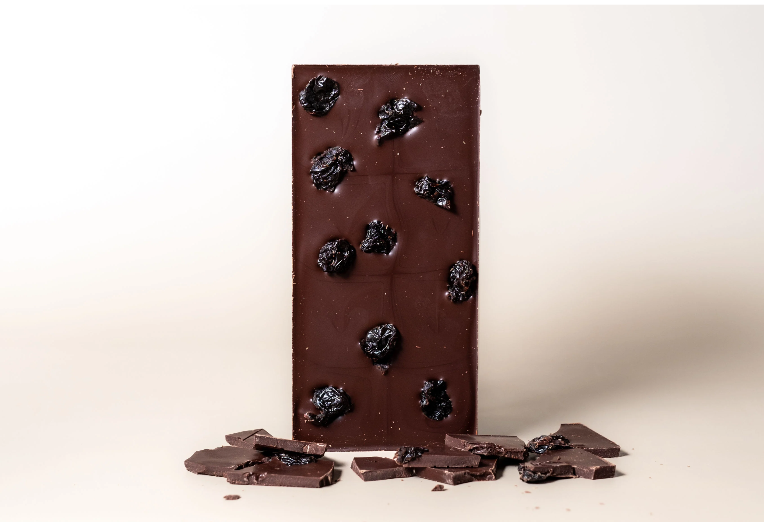 Ritual Dark Cherry Vanilla Bar 70% with raisins on smooth brown surface