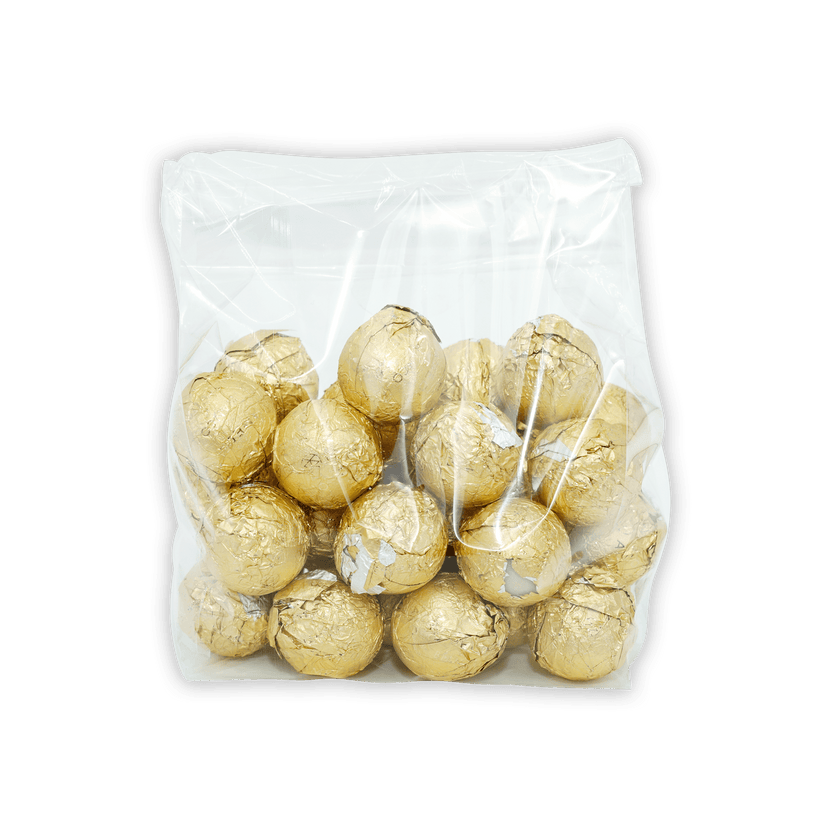 Amedei Pralines White w/ Hazelnut Filling in clear bag of golden truffles