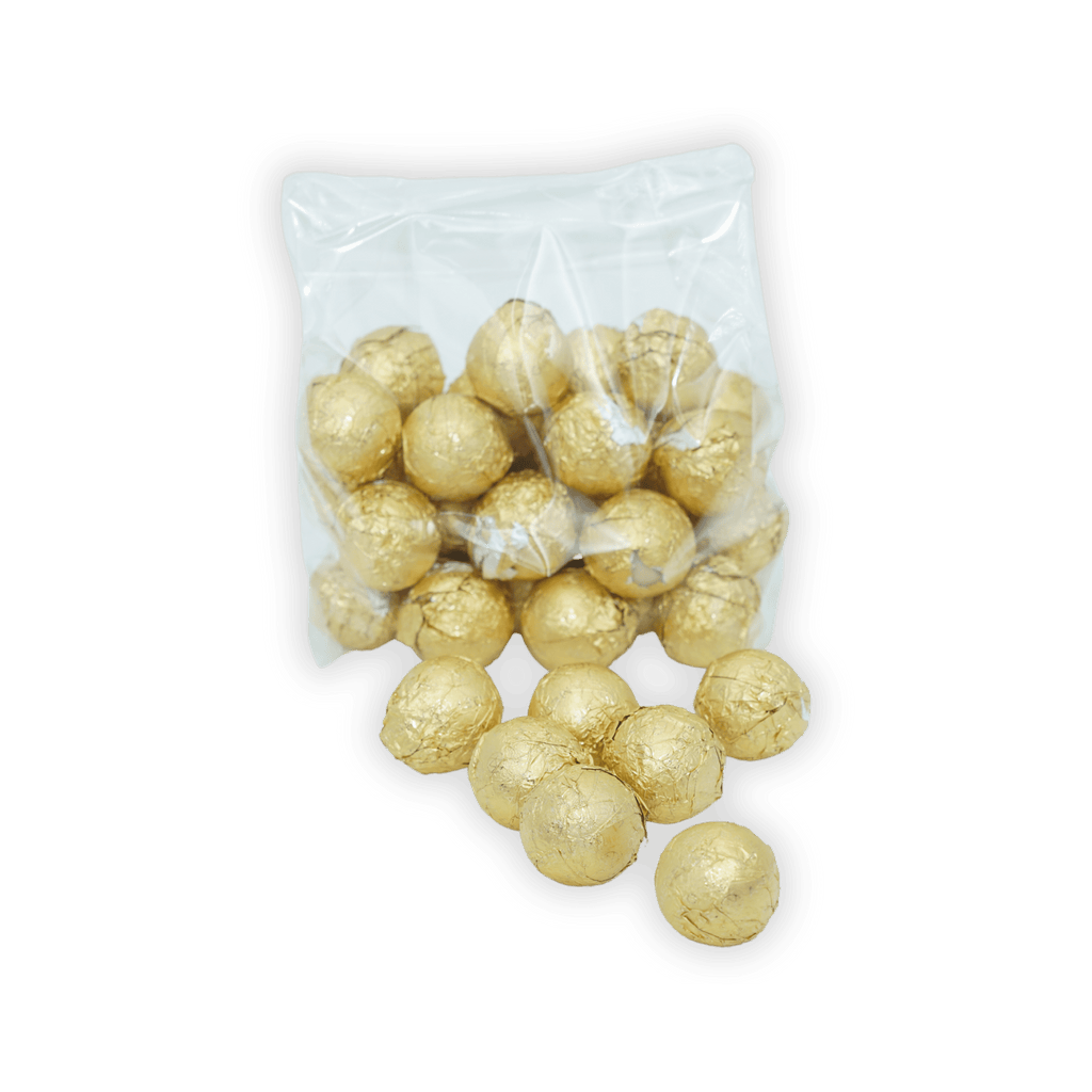 Amedei Pralines White w/ Hazelnut Filling in clear bag with spilling golden truffles