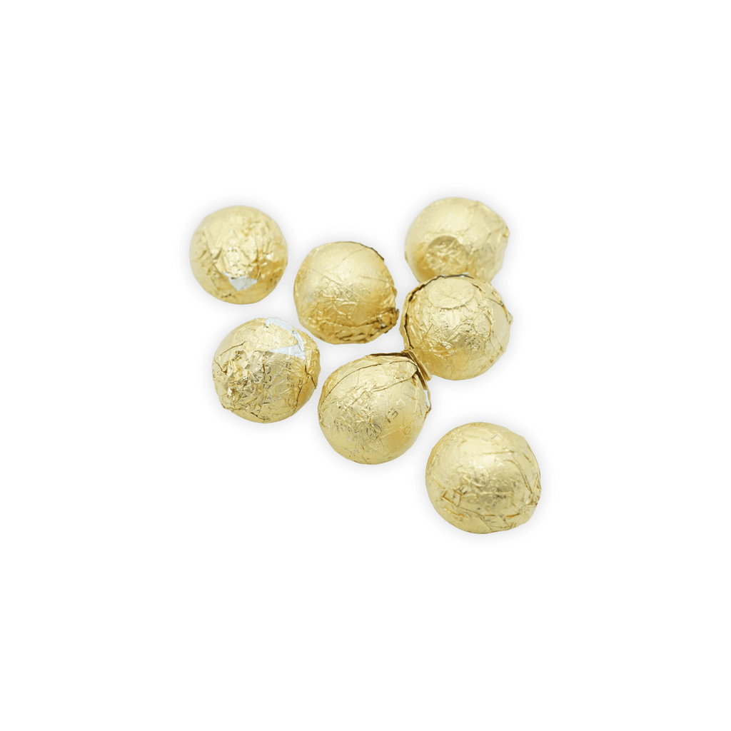 Seven Amedei white pralines with hazelnut filling, golden foil truffles