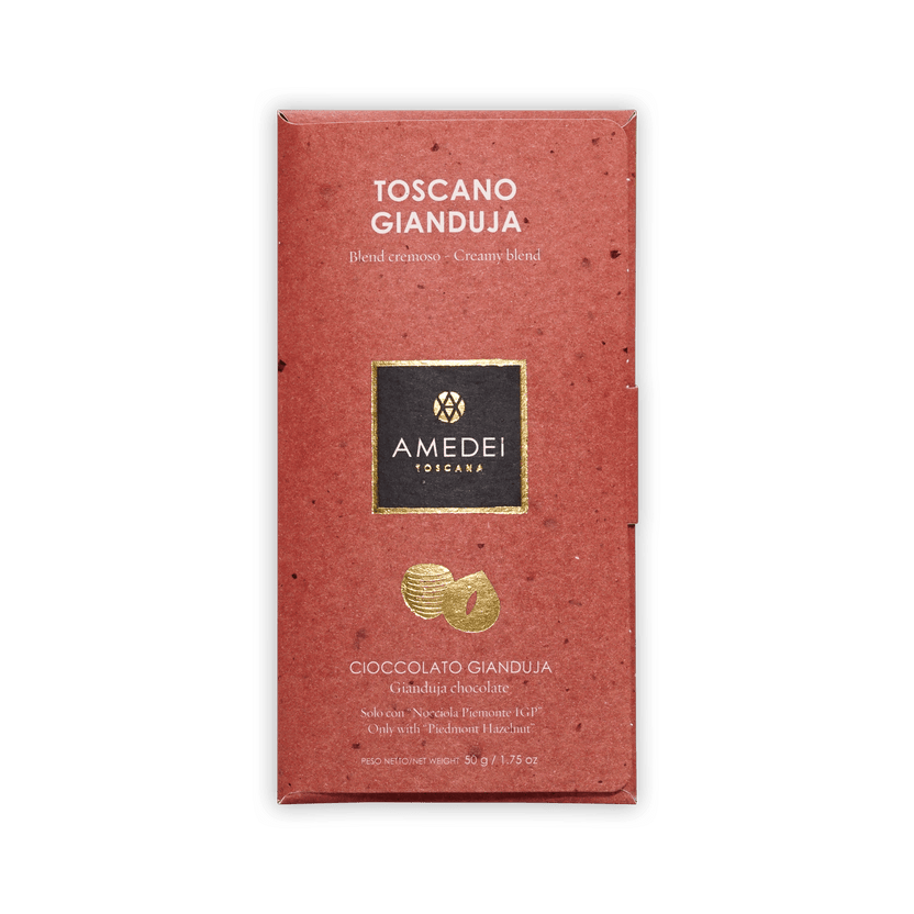 Amedei Toscano Gianduja bar in a dusty-red box with gold logo and hazelnut motif, labeled Cioccolato Gianduja, 50g.