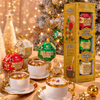 Auro Chocobomb hot chocolate gift set next to cups of hot chocolate, with a lit Christmas tree behind.