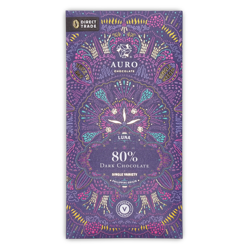 A purple wrapper for Auro Chocolate Luna 80% Dark Chocolate with intricate pink, teal, and gold patterns.