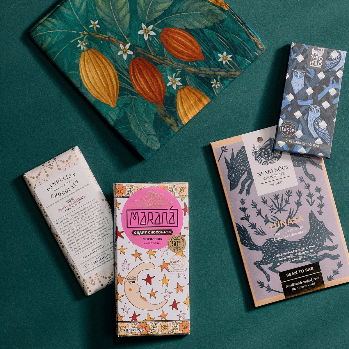 70 cm cotton furoshiki gift wrap showing a crane, cacao pod, and botanical print beside craft chocolate bars
