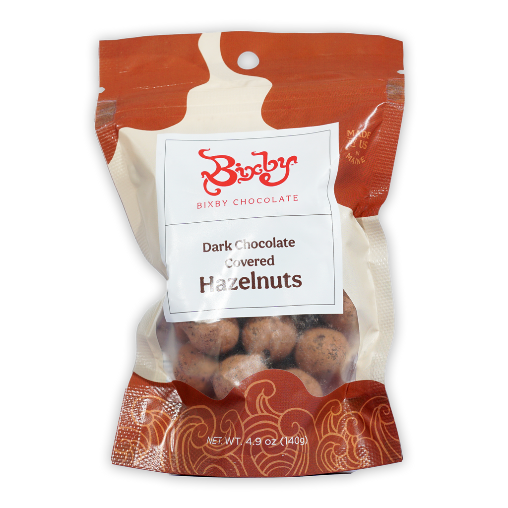 Bixby dark chocolate covered hazelnuts in red cream package with window