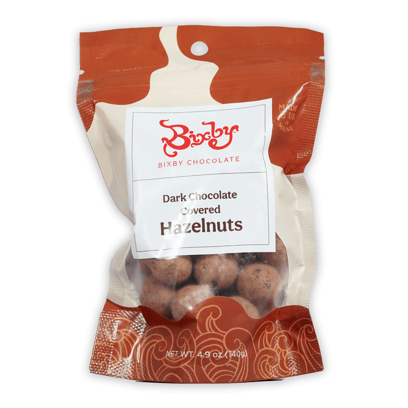 Bixby dark chocolate covered hazelnuts in red cream package with window