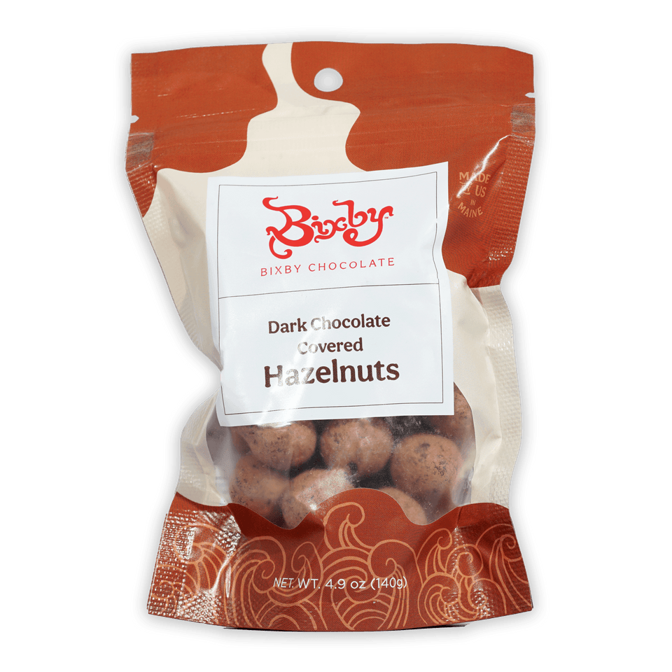 Bixby dark chocolate covered hazelnuts in red cream package with window