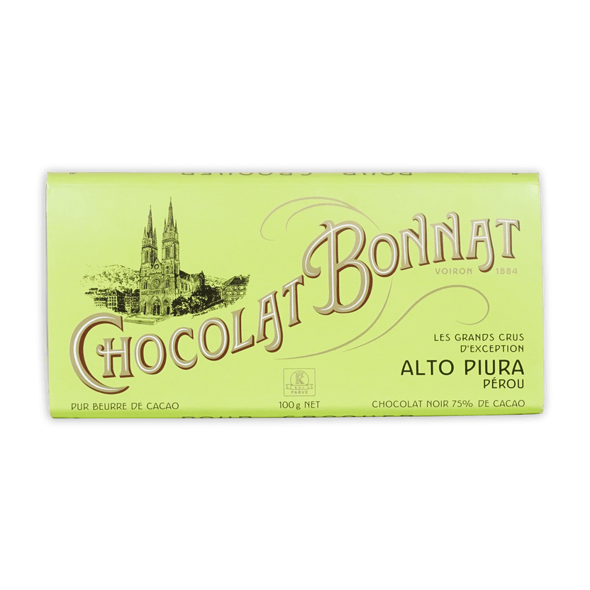 A pale green wrapper for bonnat peru alto piura 70 percent dark chocolate featuring gold lettering and a historic church illustration