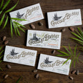 Five Bonnat single origin bars on dark wood.
