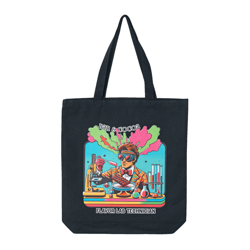 Black canvas tote bag with cartoon flavor lab tech and lab gear