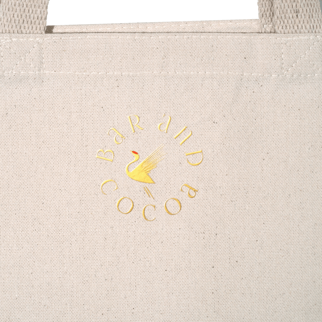 Beige canvas eco tote bag with gold foil Bar and Cocoa crane logo
