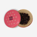 Domori chocolate coated amarena cherries tin with pink gold design
