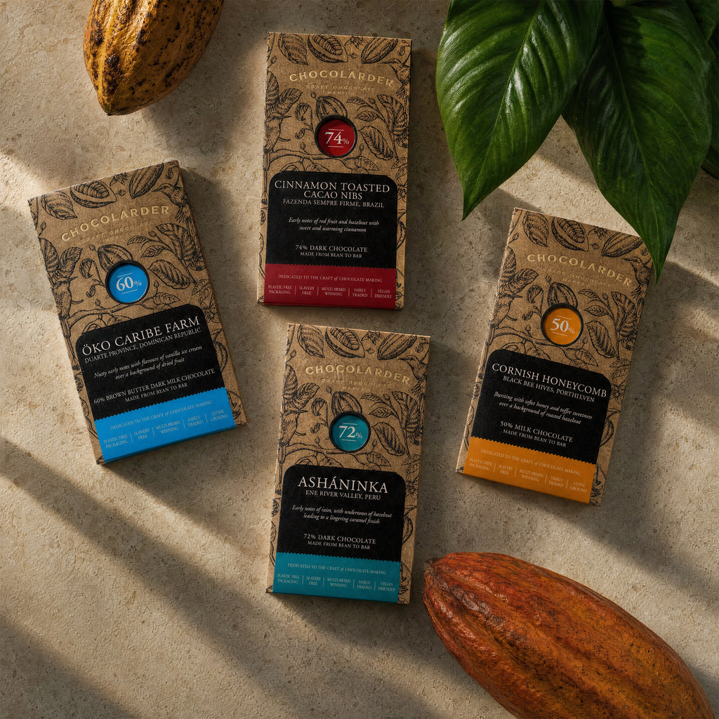 Four Chocolarder bars with cacao pods: Öko Caribe 60%, Cinnamon Toasted Cacao Nibs 74%, Ashaninka 72%, Cornish Honeycomb 50%