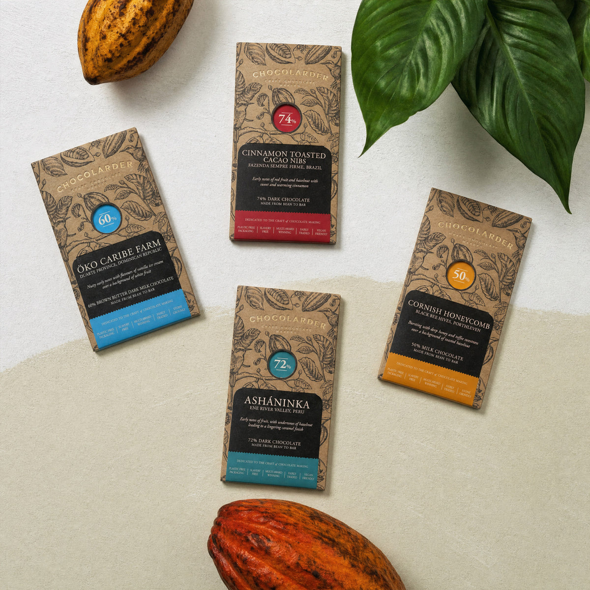 Four Chocolarder bars with cacao pods: Öko Caribe 60%, Cinnamon Toasted Cacao Nibs 74%, Ashaninka 72%, Cornish Honeycomb 50%