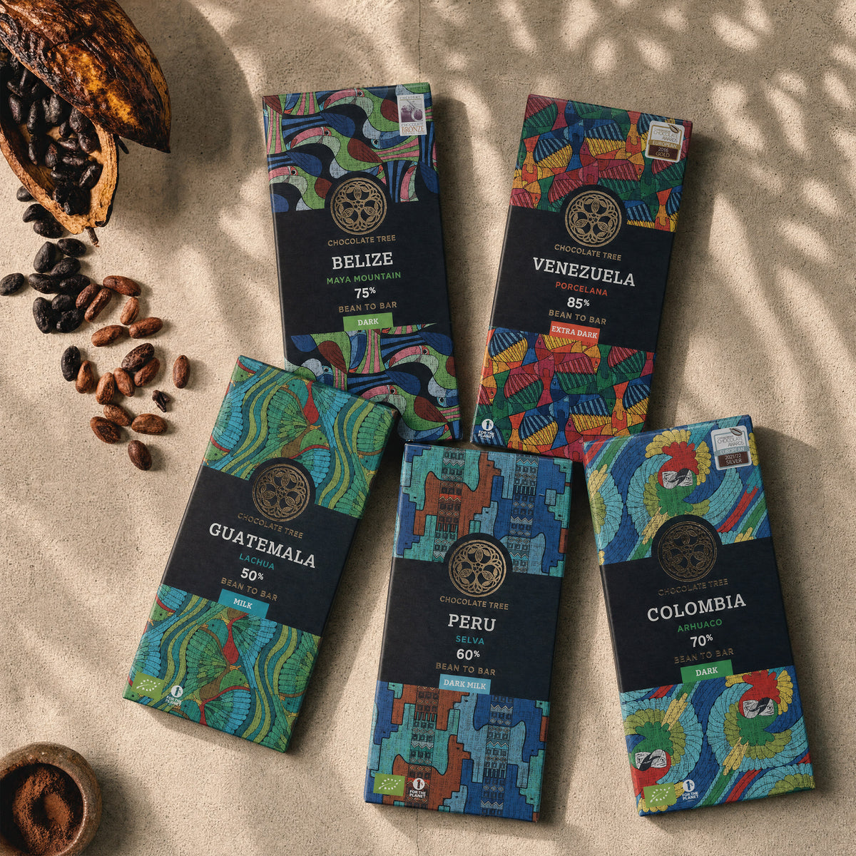 Five Chocolate Tree single origin bars with cacao pods.