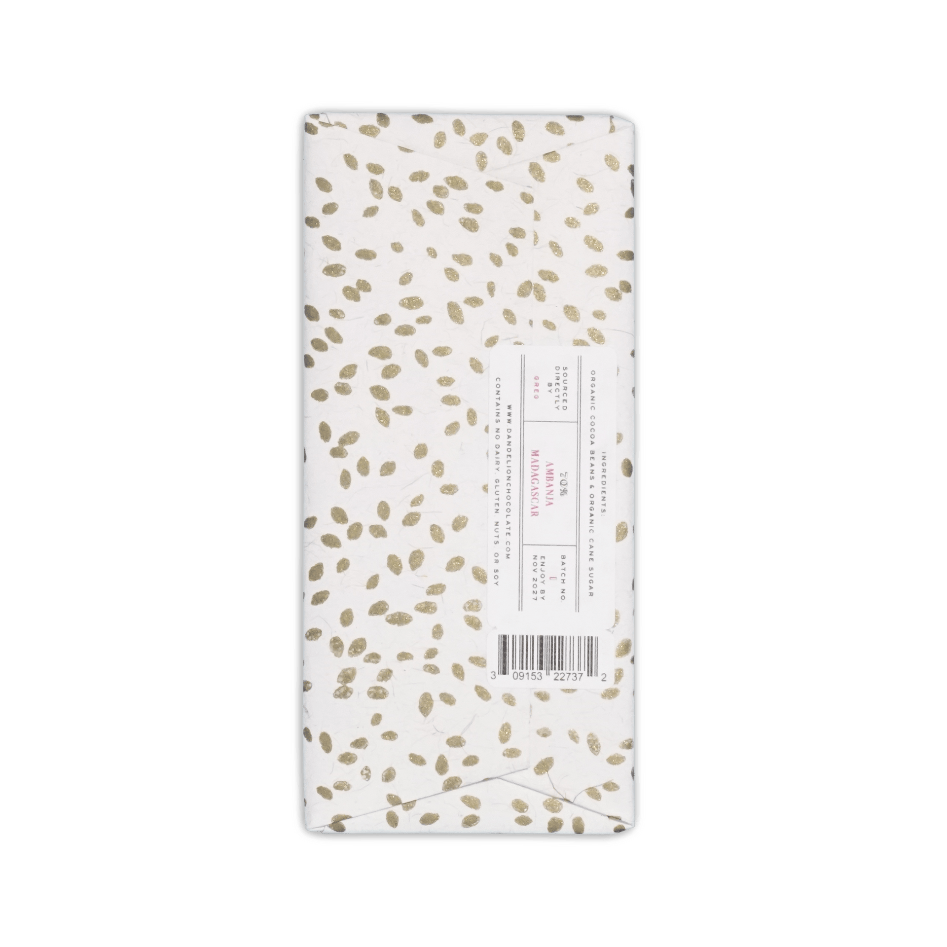 Back of Dandelion bar in gold-speckled white paper, sideways label reading 70% Ambanja Madagascar with barcode