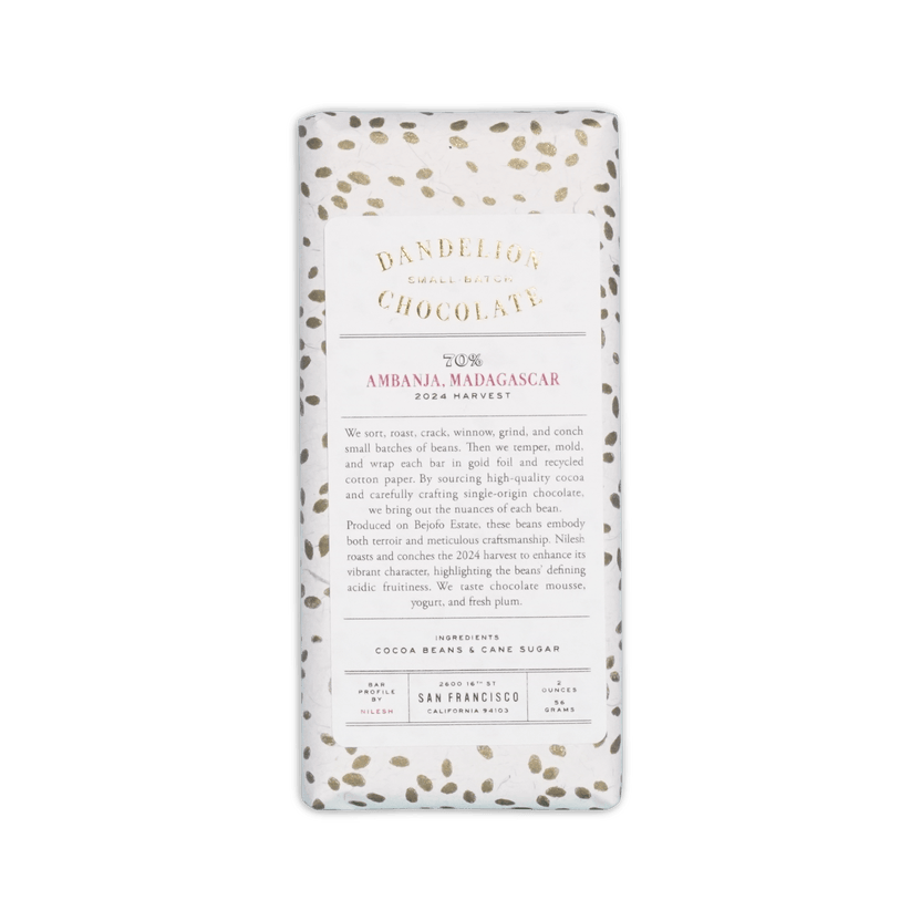 Dandelion Chocolate bar in white cotton paper with gold speckles, label reading 70% Ambanja Madagascar 2024 Harvest