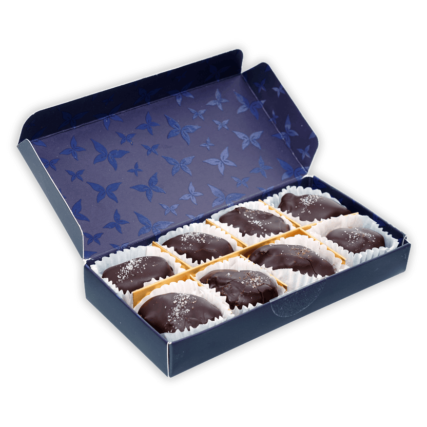 Definite 100% dark chocolate covered dates with macadamia in navy box