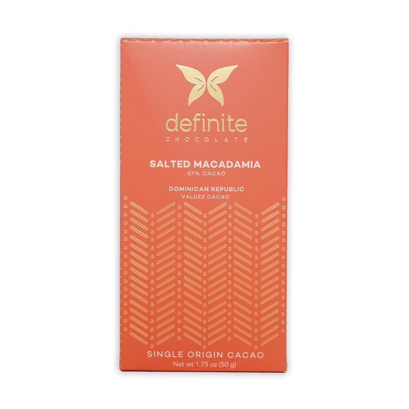 Definite Cashew Milk Chocolate w/ Macadamia 57% coral wrapper with gold butterfly