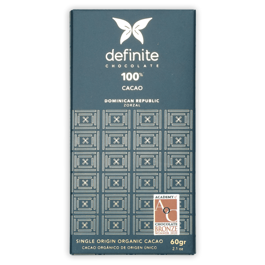 Definite Zorzal 100% dark teal chocolate bar wrapper with white text and geometric patterns