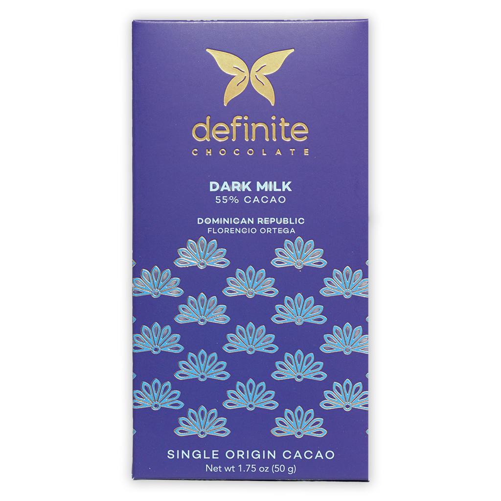 Definite Dark Milk Chocolate 55% bar wrapper with gold butterfly logo