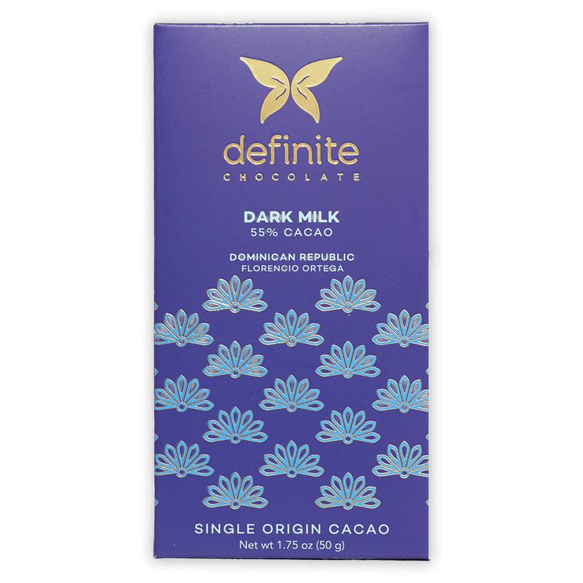 Definite Dark Milk Chocolate 55% bar wrapper with gold butterfly logo