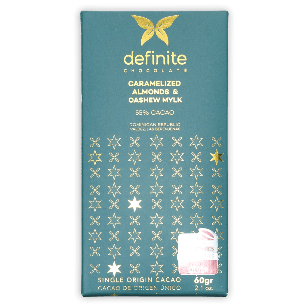Teal Definite Cashew Milk Chocolate bar with caramelized almonds, gold butterfly logo