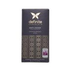 Definite Chocolate 100% Cacao Zorzal bar in a charcoal box with a gold butterfly logo and a silver award seal.