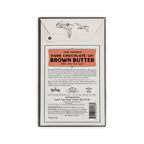 Back of Dick Taylor 73% Uganda Dark Chocolate with Brown Butter box, orange panel, ingredients, and nutrition facts.
