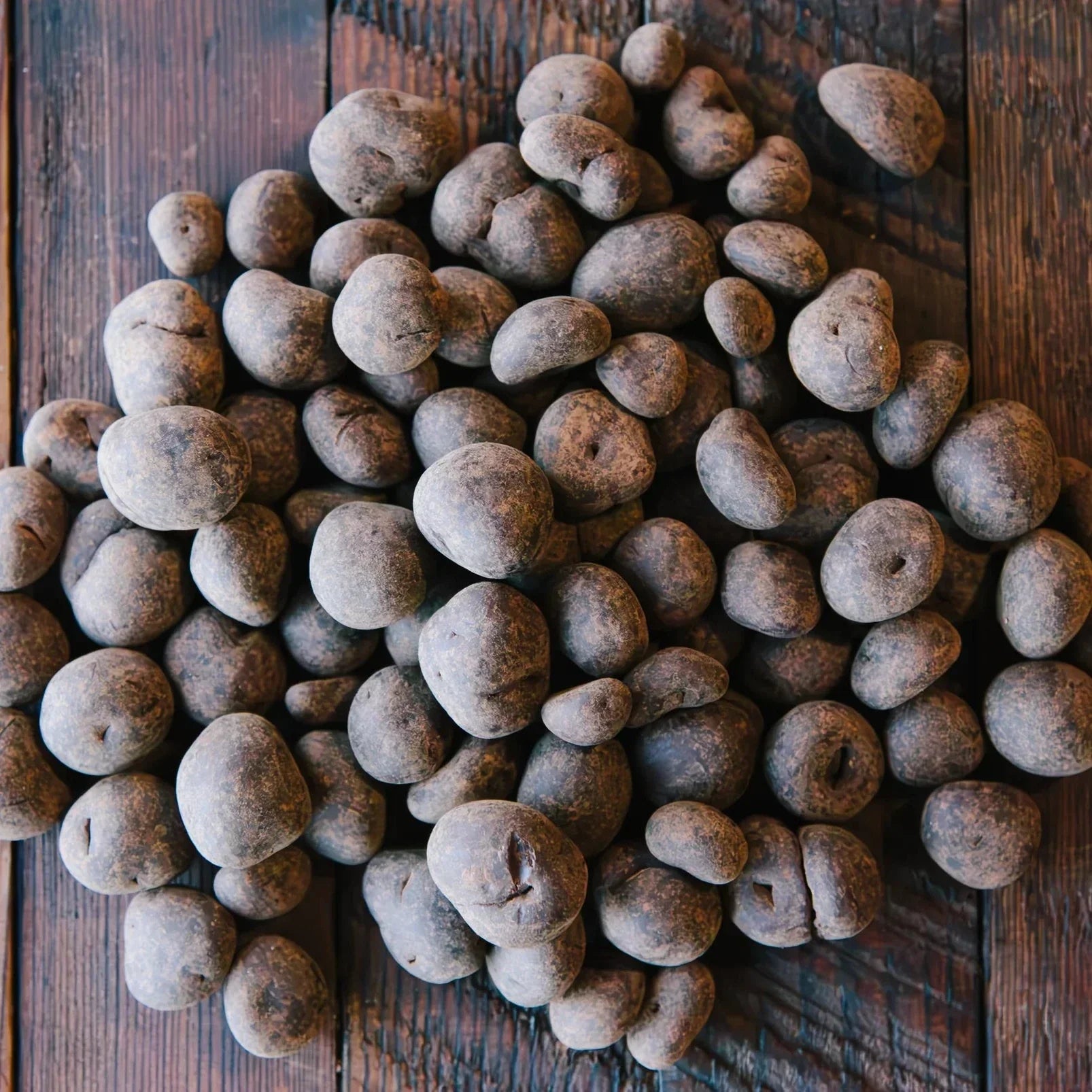 Dick Taylor chocolate coated butter toffee hazelnuts 65% with earthy brown truffles