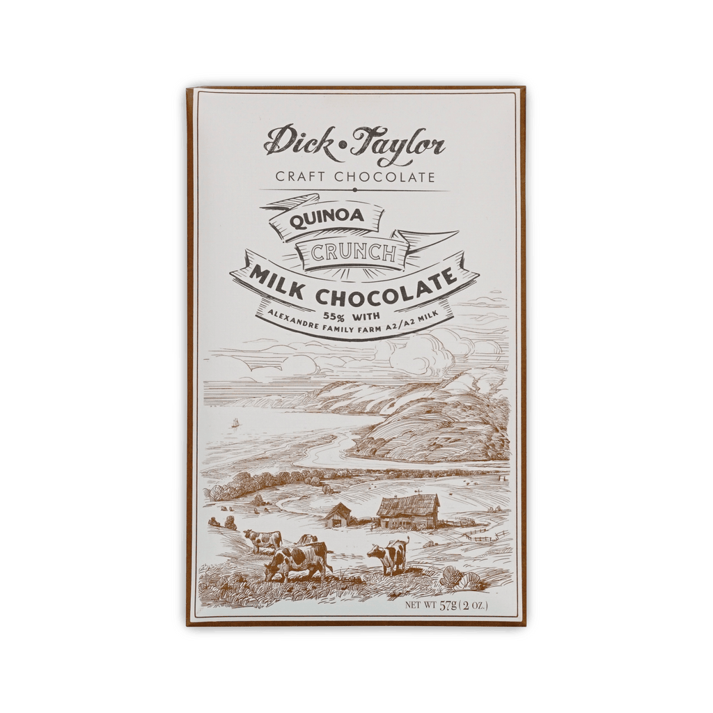 Dick Taylor bar, cream box with etched coastal farm and cows, reading Quinoa Crunch Milk Chocolate 55%.