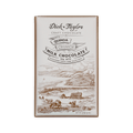 Dick Taylor bar, cream box with etched coastal farm and cows, reading Quinoa Crunch Milk Chocolate 55%.