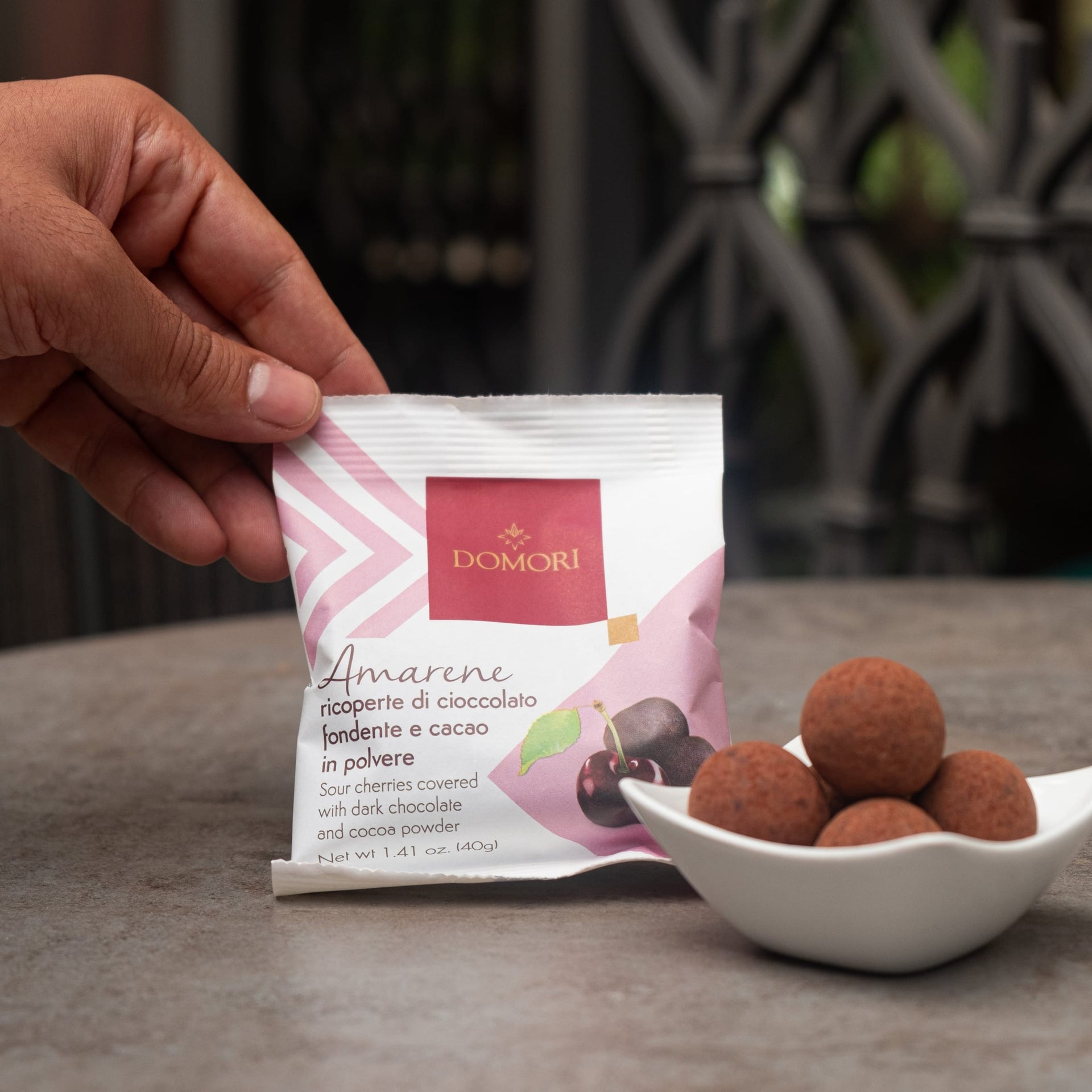 Domori Dragees: pink white bag of amarene cherries in dark chocolate cocoa