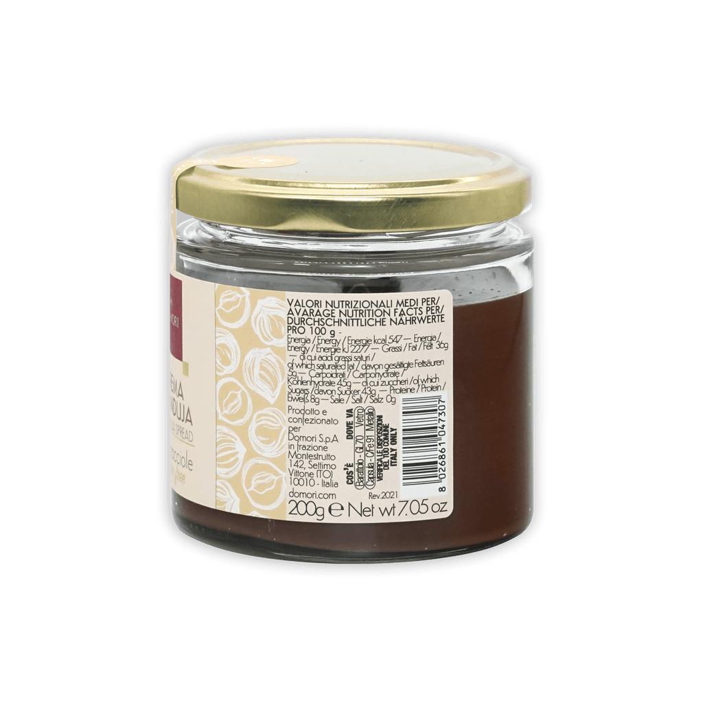 Domori Crema Gianduja Spread in clear glass jar with gold lid